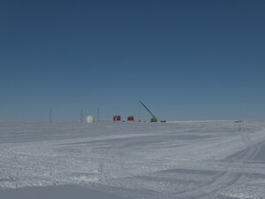 Preparations for the next winter season, the raising of the VSAT dome (communications), the IT caboose and the MET caboose. The Sennebogen crane sits near to the weather apparatus and the uprights for the HF antenna can also be seen.